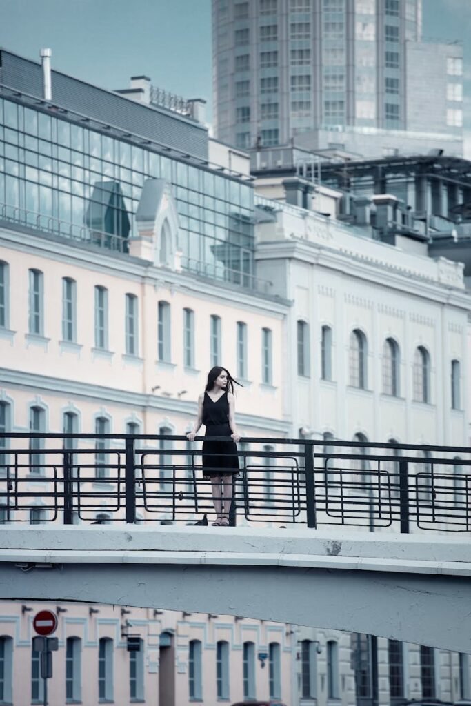 Woman Holding Fence