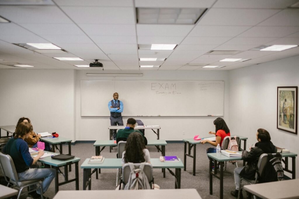 Teacher Proctoring His Students During an Examination